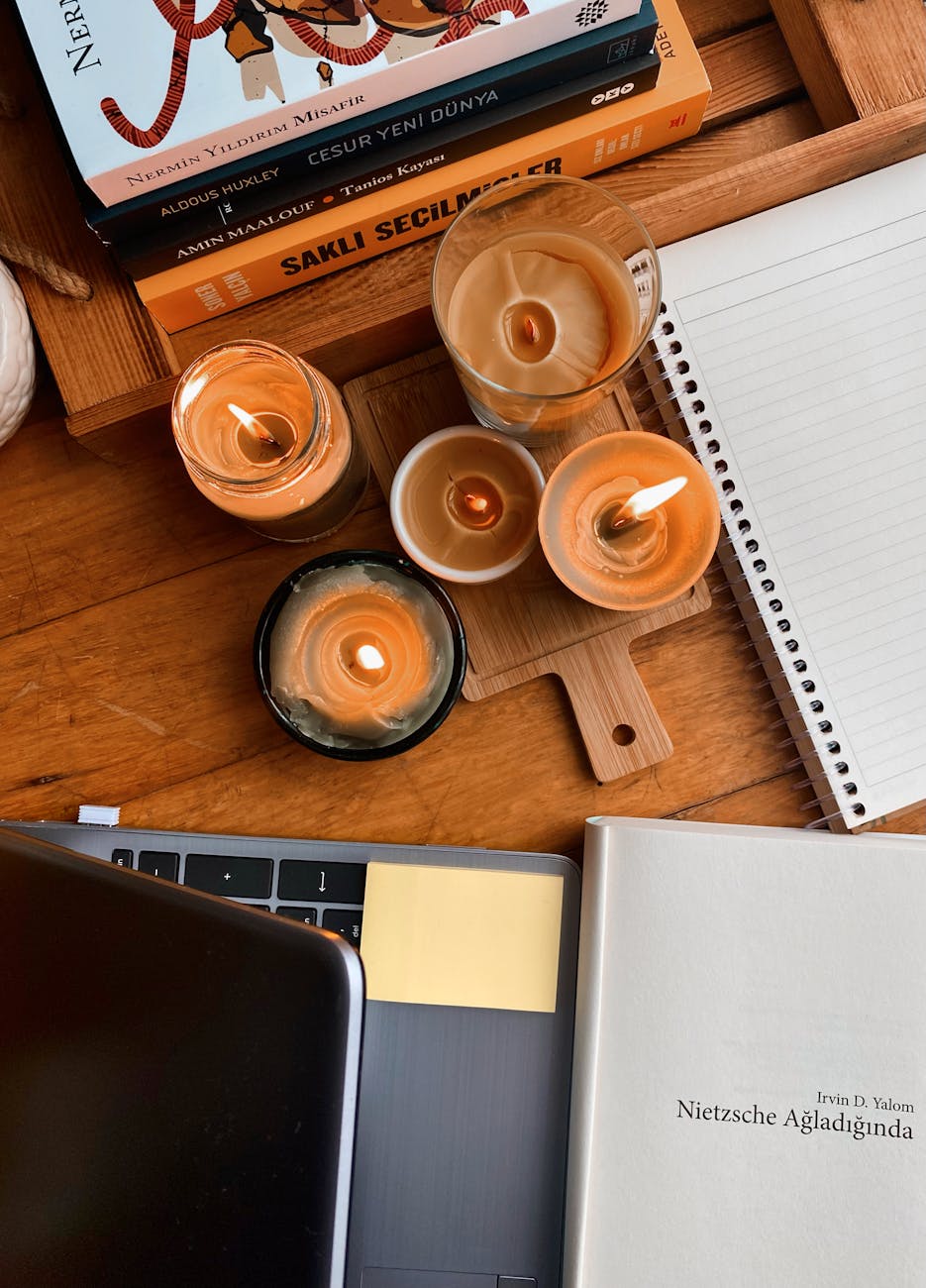 cozy workspace with candles and books